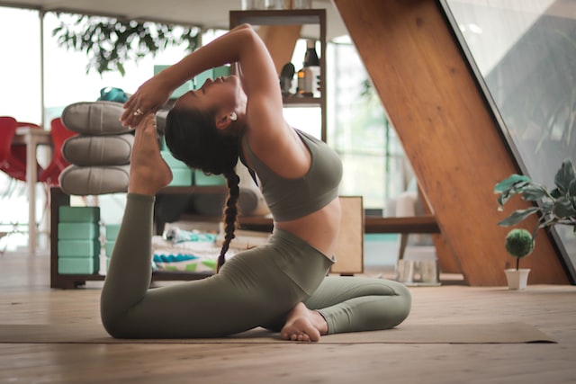 Image of woman in yoga post in living room